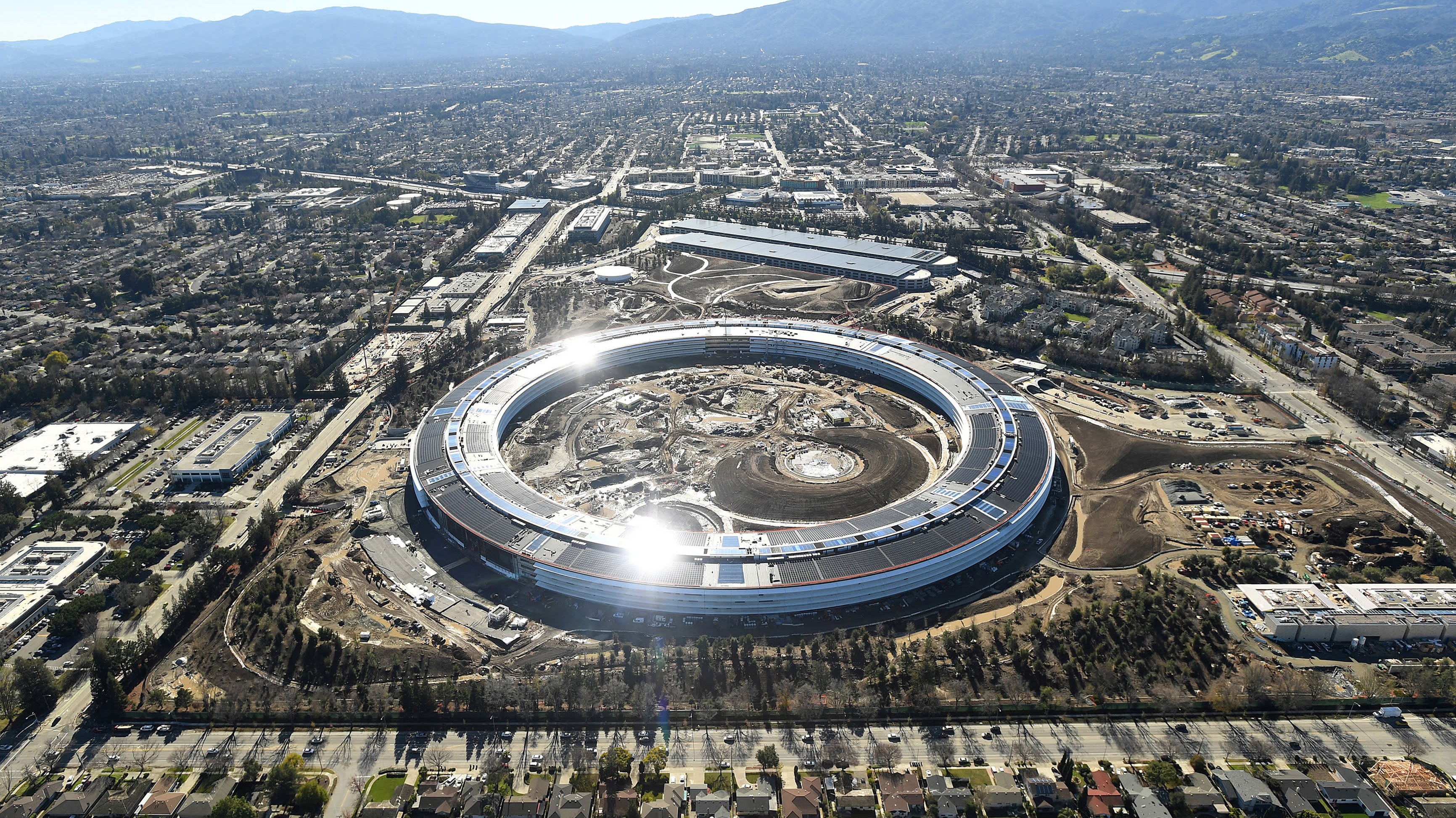 Aerial view of modern Silicon Valley tech campus with expansive facilities representing Big Tech's massive AI infrastructure investments