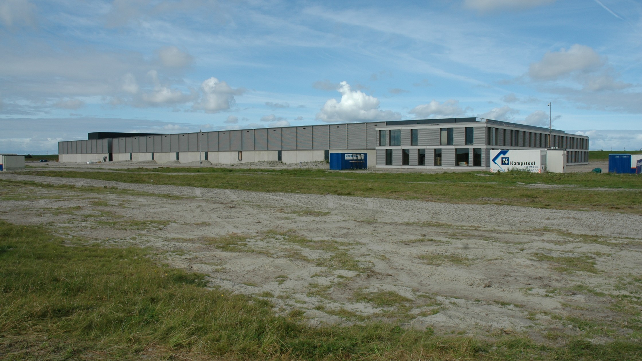 Modern AI data center construction site showing massive facility development representing the $315 billion infrastructure buildout
