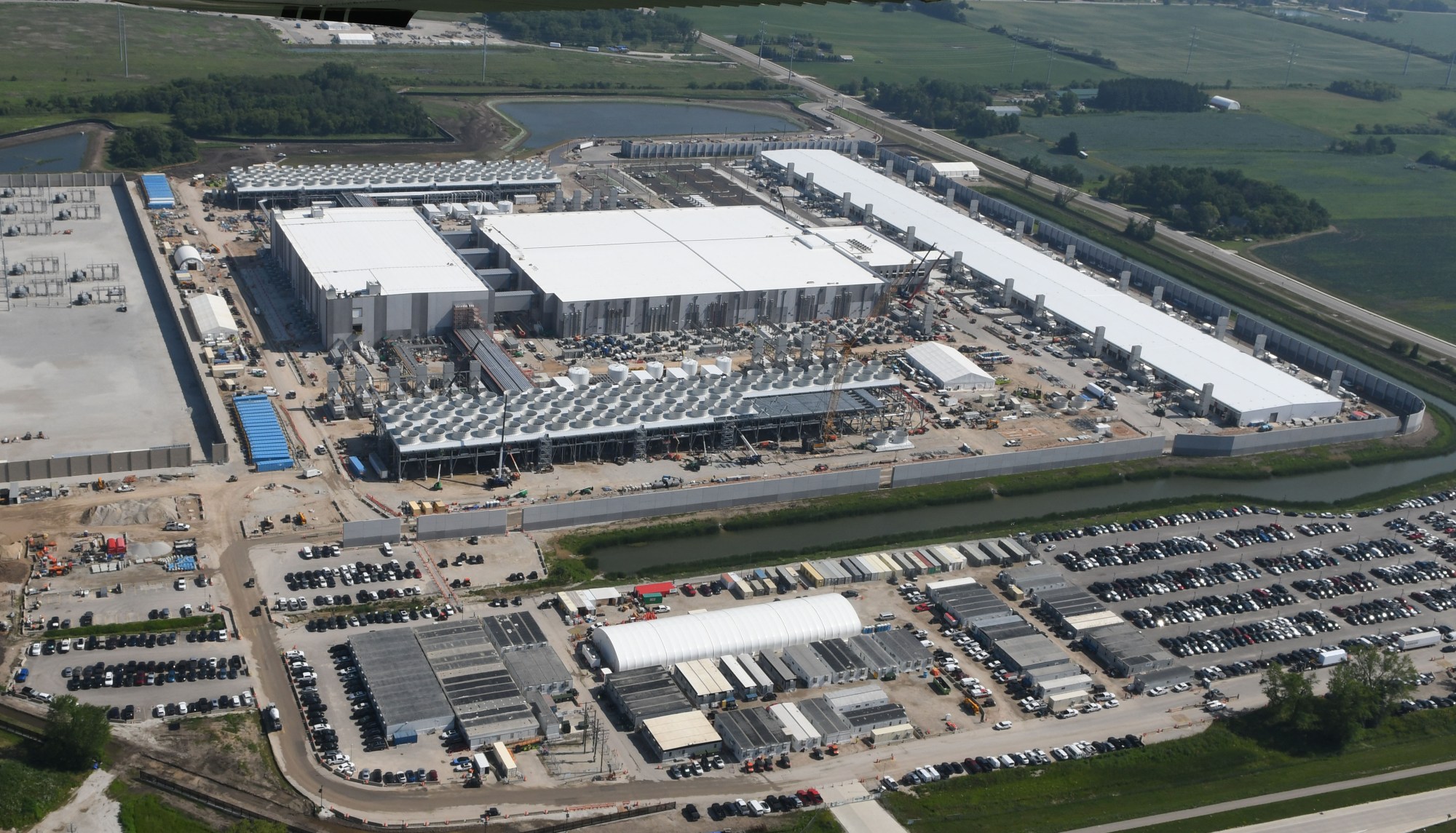 Construction site of a modern data center facility with large-scale building expansion underway